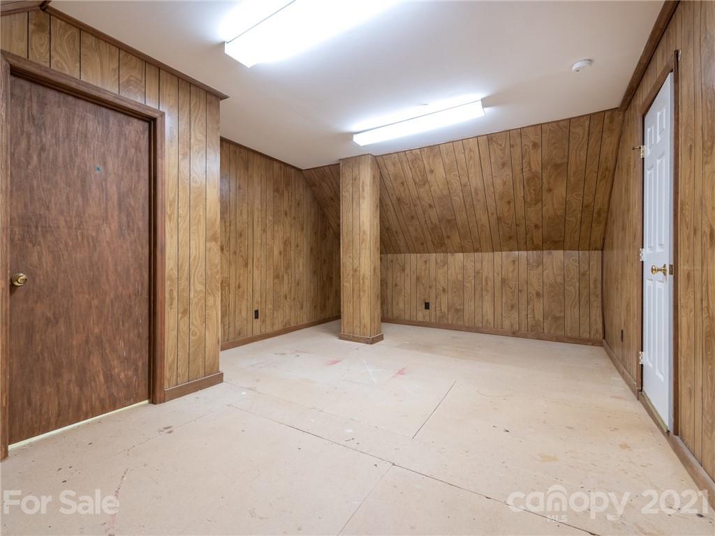 925 Reverdy Lane Matthews, NC 28105 - Photo 28 of 36 a view of an empty room with wooden walls