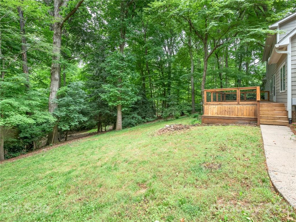 925 Reverdy Lane Matthews, NC 28105 - Photo 31 of 36 a view of a backyard with a small cabin