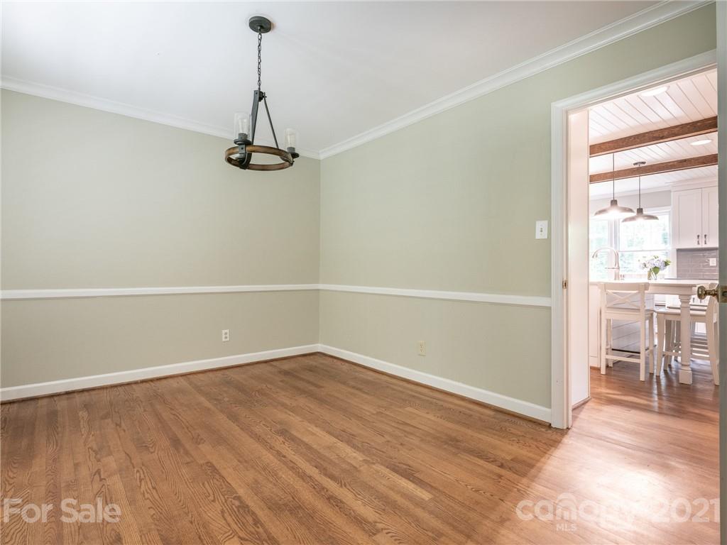 925 Reverdy Lane Matthews, NC 28105 - Photo 5 of 36 a view of a room with wooden floor kitchen view and a window