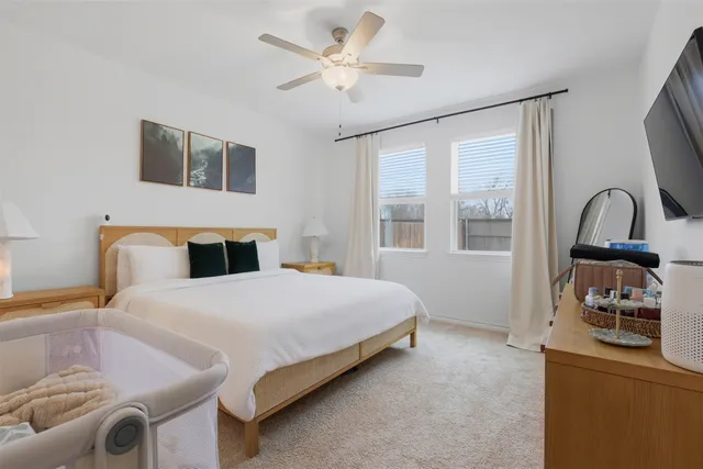 a bedroom with a bed next to a window with outer view