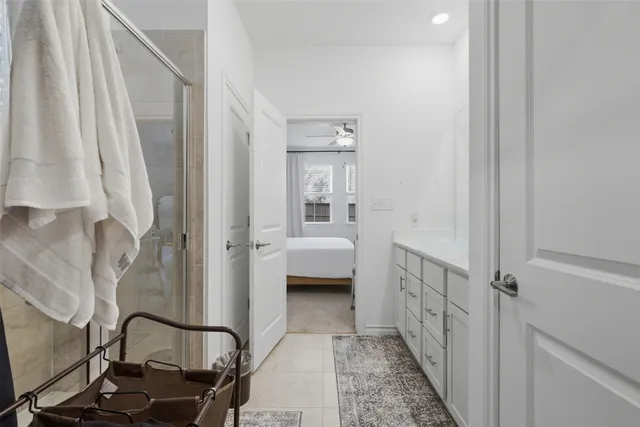 a en suite bathroom with a sink a toilet and a mirror
