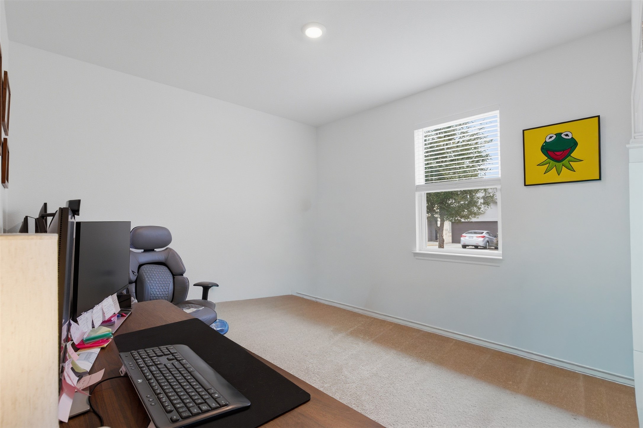 203 Stinchcomb Road Hutto, TX 78634 - Photo 21 of 30 Home office with light carpet and light wood-style floors