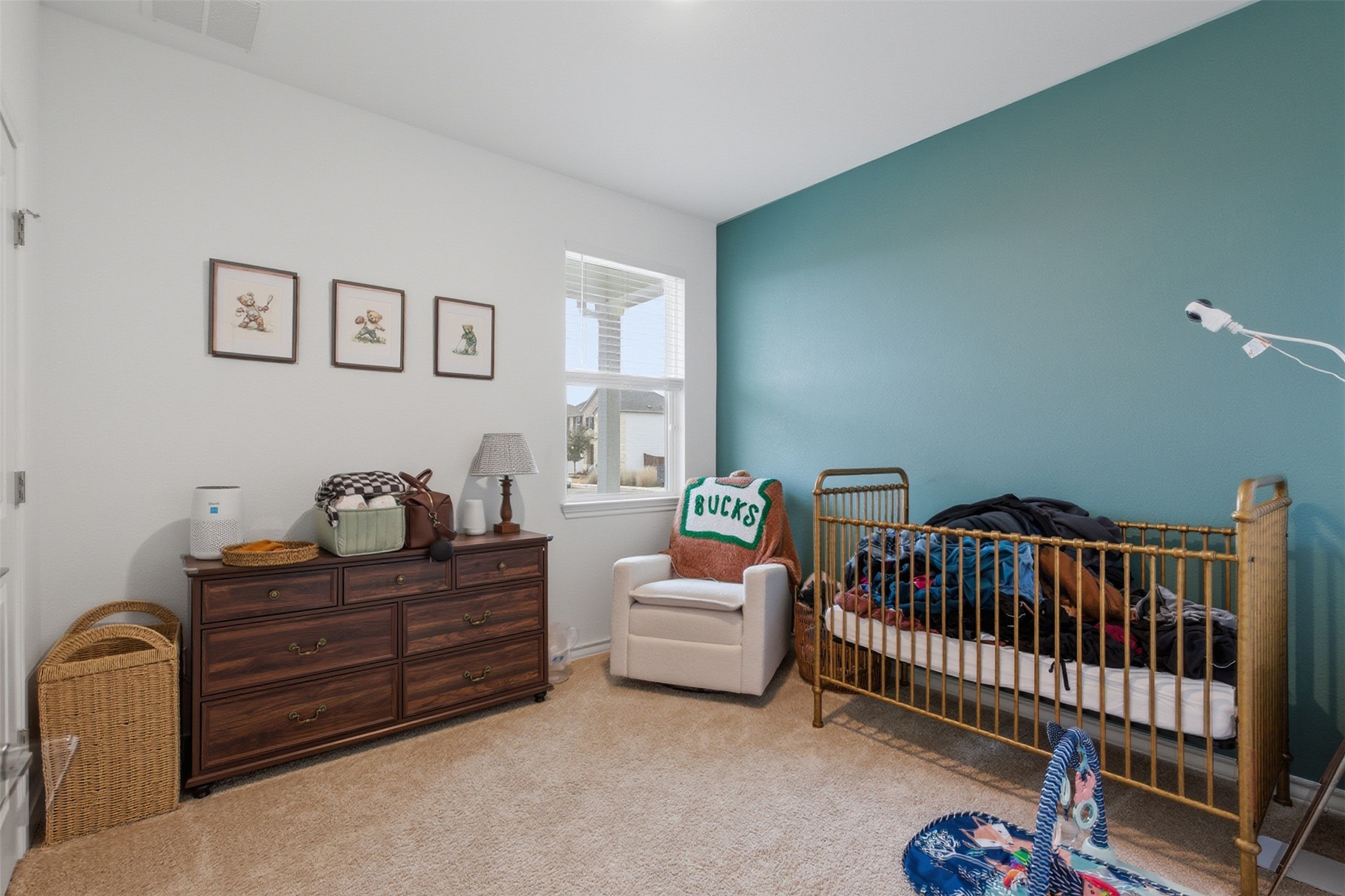 203 Stinchcomb Road Hutto, TX 78634 - Photo 22 of 30 Bedroom with a nursery area and light carpet