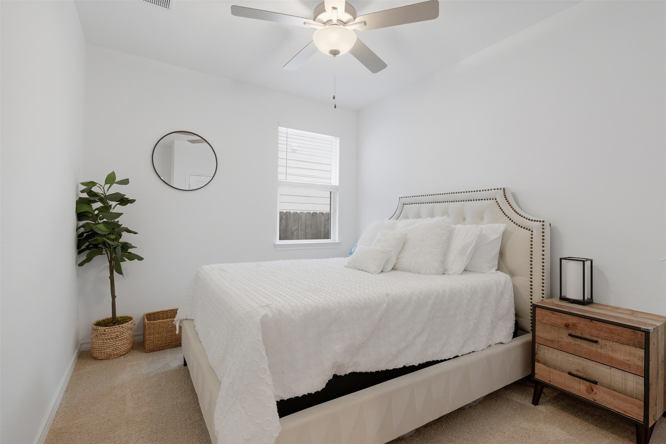 203 Stinchcomb Road Hutto, TX 78634 - Photo 23 of 30 Bedroom featuring light colored carpet and a ceiling fan