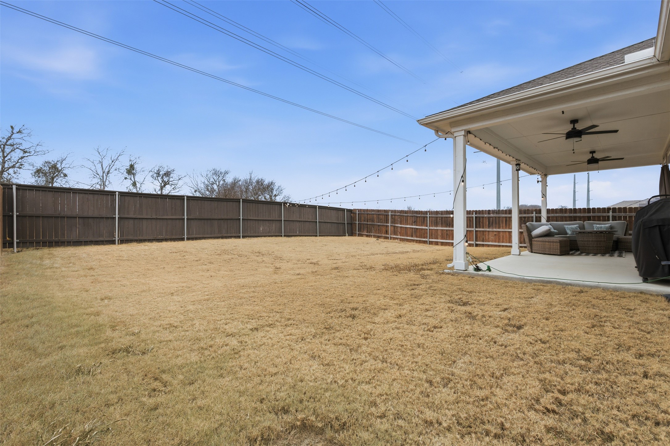 203 Stinchcomb Road Hutto, TX 78634 - Photo 27 of 30 Fenced backyard with a patio and ceiling fan