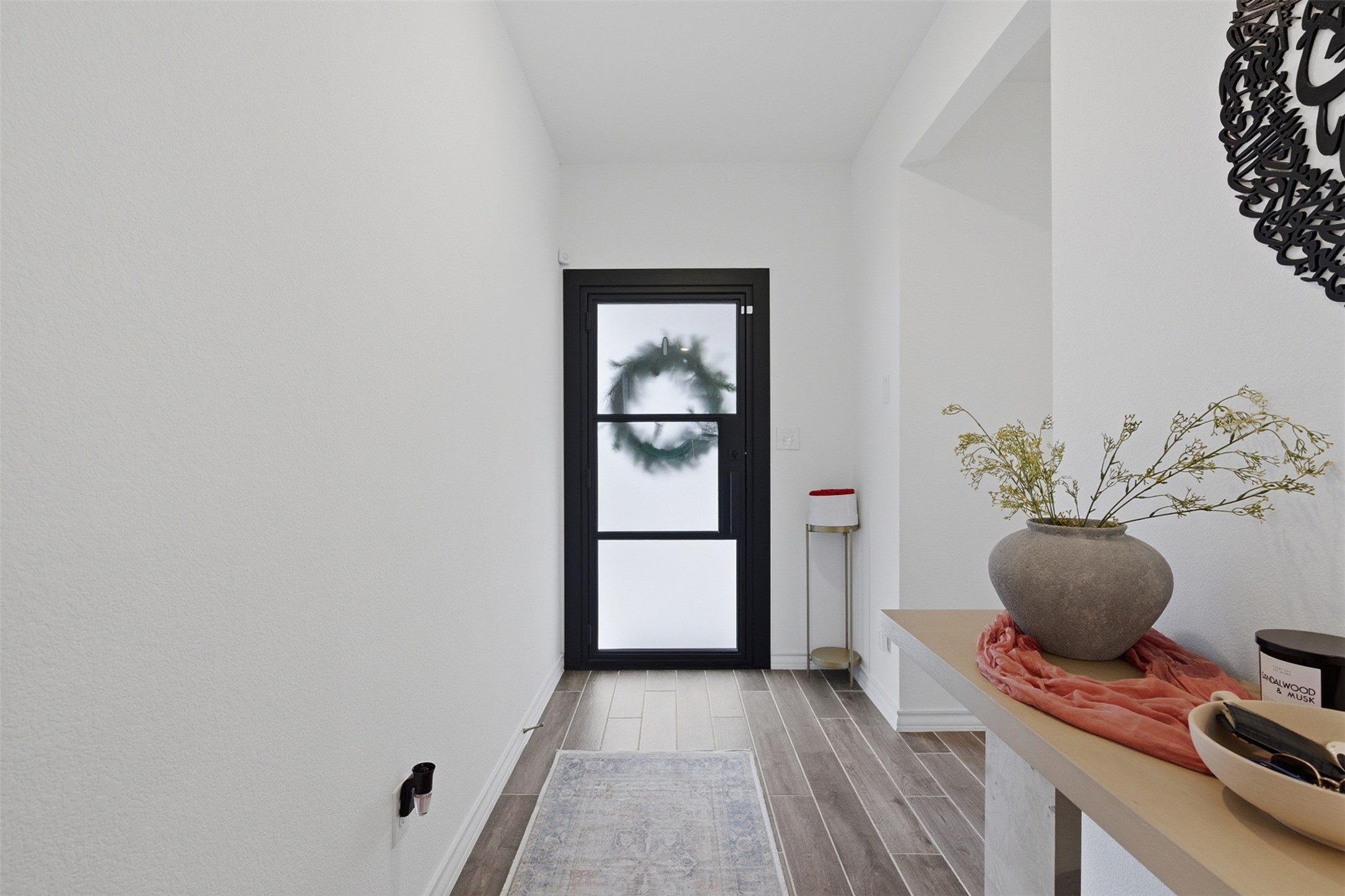 203 Stinchcomb Road Hutto, TX 78634 - Photo 5 of 30 Entryway with wood tiled floors and baseboards