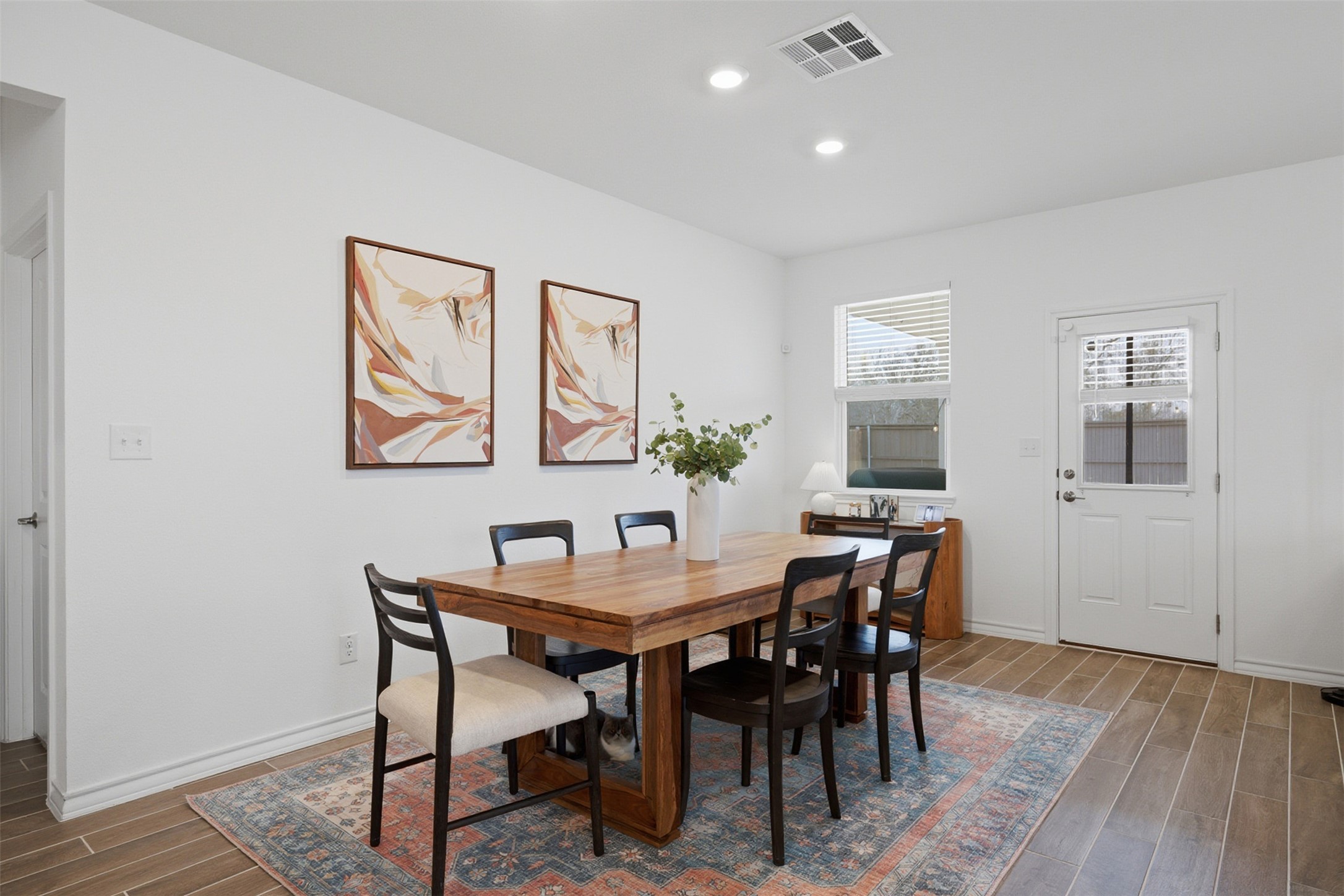 203 Stinchcomb Road Hutto, TX 78634 - Photo 9 of 30 Dining space featuring wood tiled floors and recessed lighting