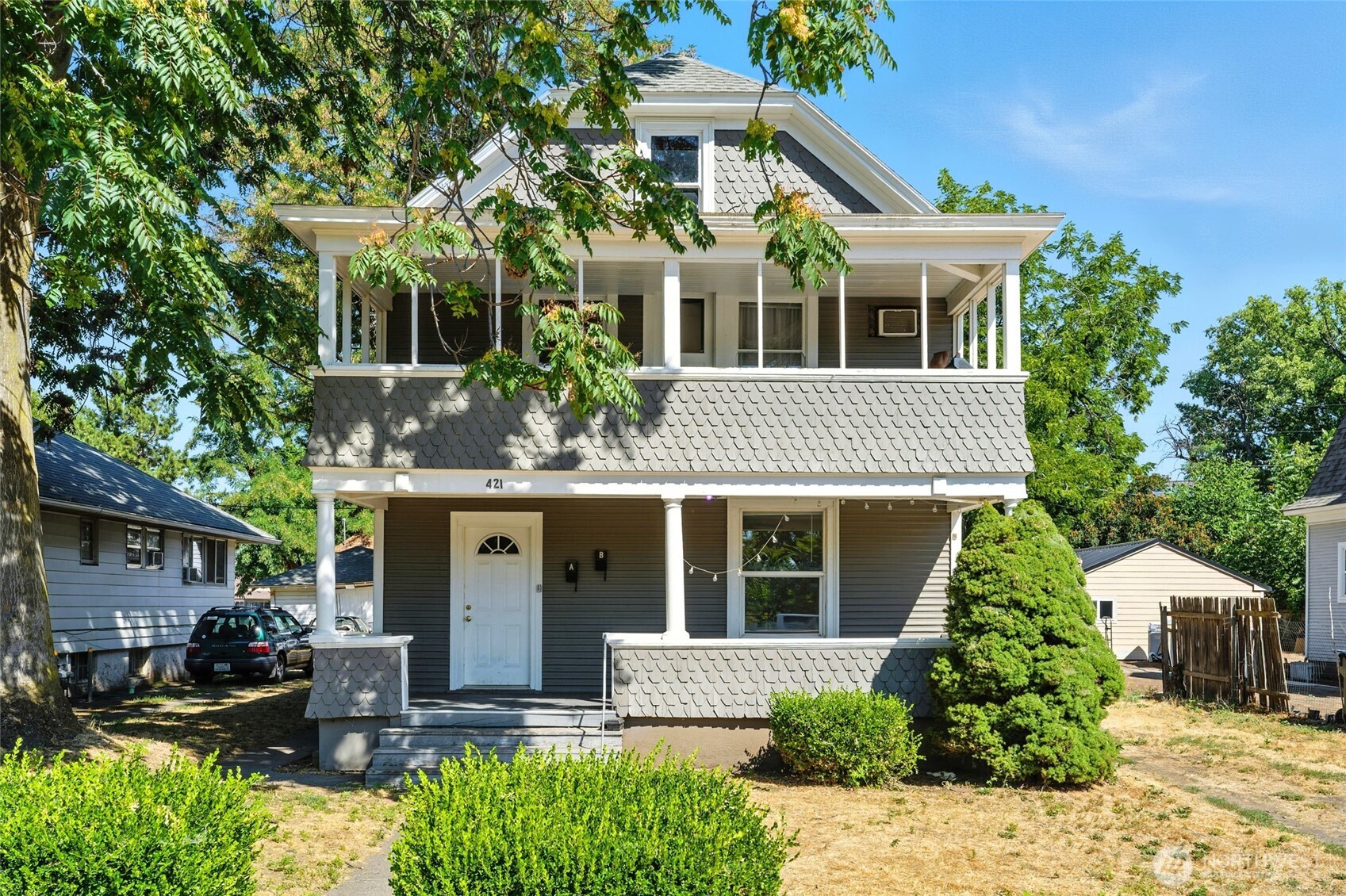 front view of a house with a yard