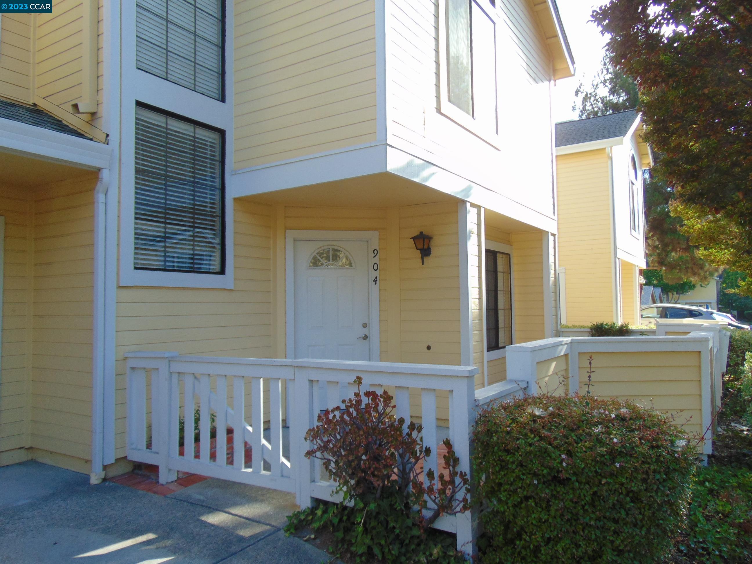 904 Devonwood Hercules, CA 94547 - Photo 2 of 18 a front view of a house with a garden