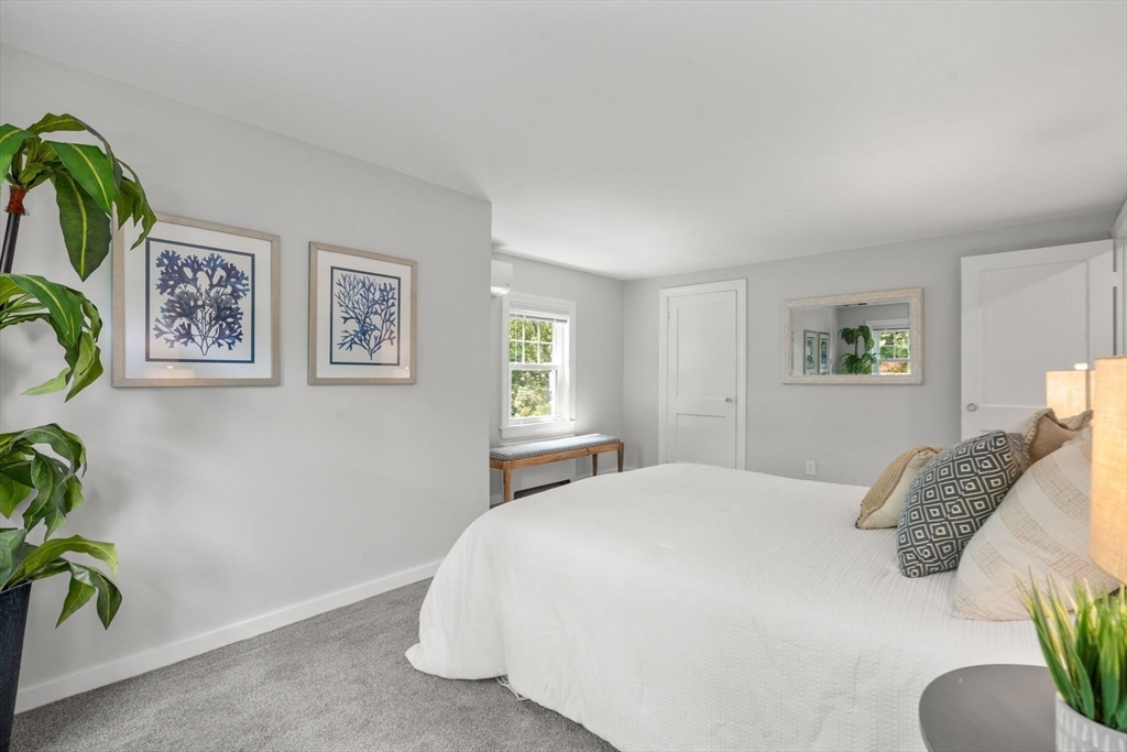 19 Conant Road Brookline, MA 02467 - Photo 14 of 18 a bedroom with a bed and a potted plant