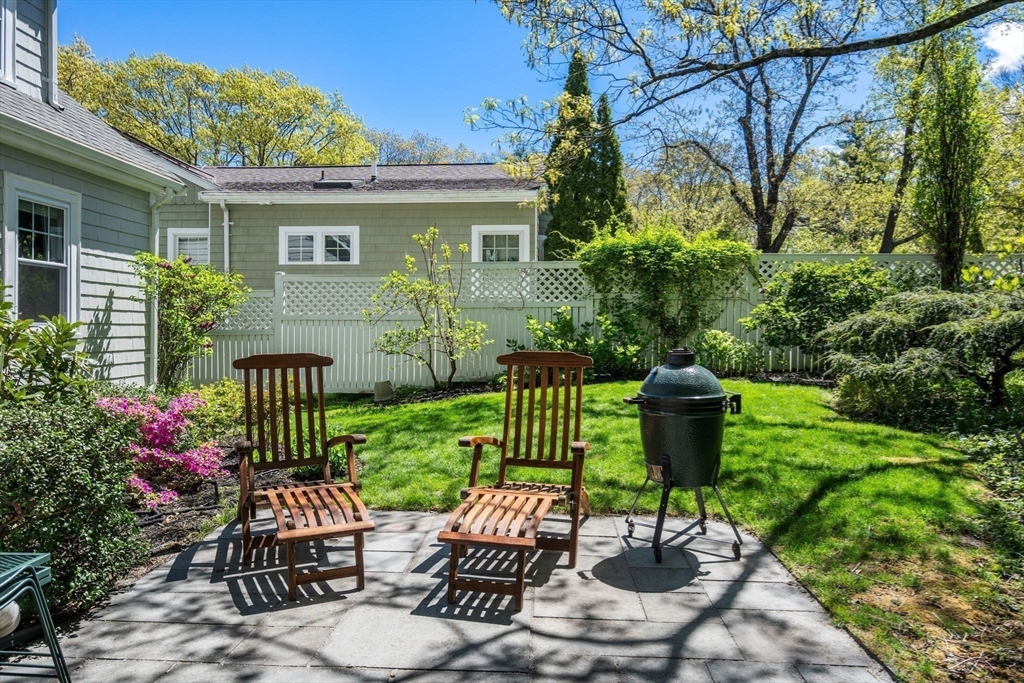 19 Conant Road Brookline, MA 02467 - Photo 17 of 18 a view of a patio with table and chairs potted plants and large tree
