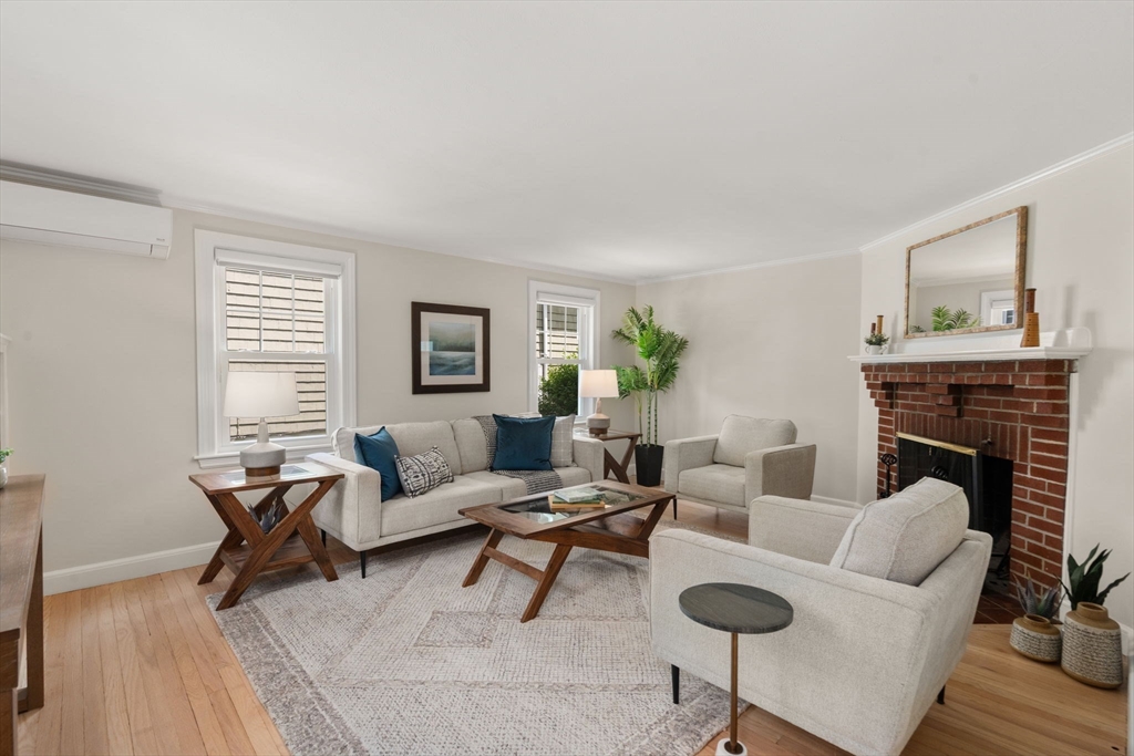 19 Conant Road Brookline, MA 02467 - Photo 4 of 18 a living room with furniture and a fireplace