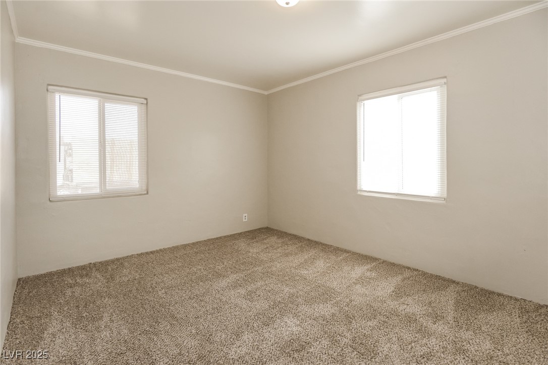 Undisclosed Address Las Vegas, NV 89107 - Photo 11 of 15 Unfurnished room featuring a wealth of natural lig