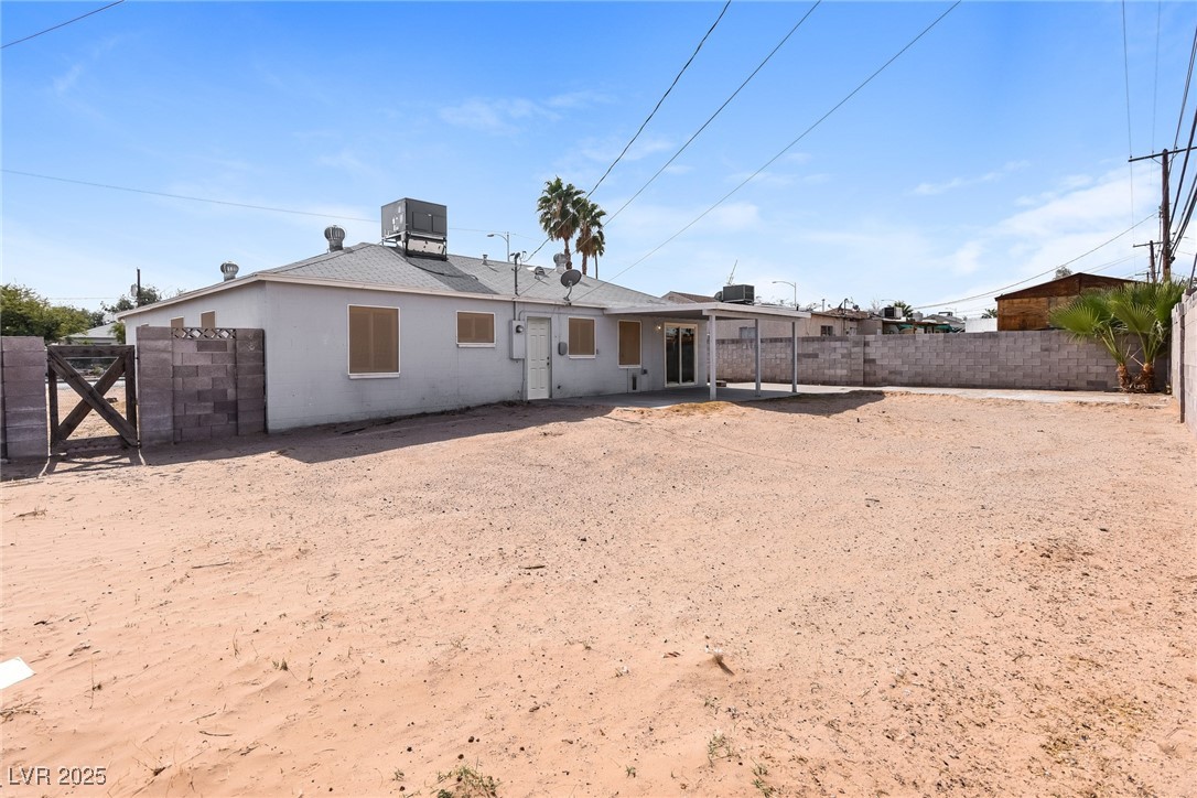 Undisclosed Address Las Vegas, NV 89107 - Photo 15 of 15 Rear view of house with a patio area, fence privat
