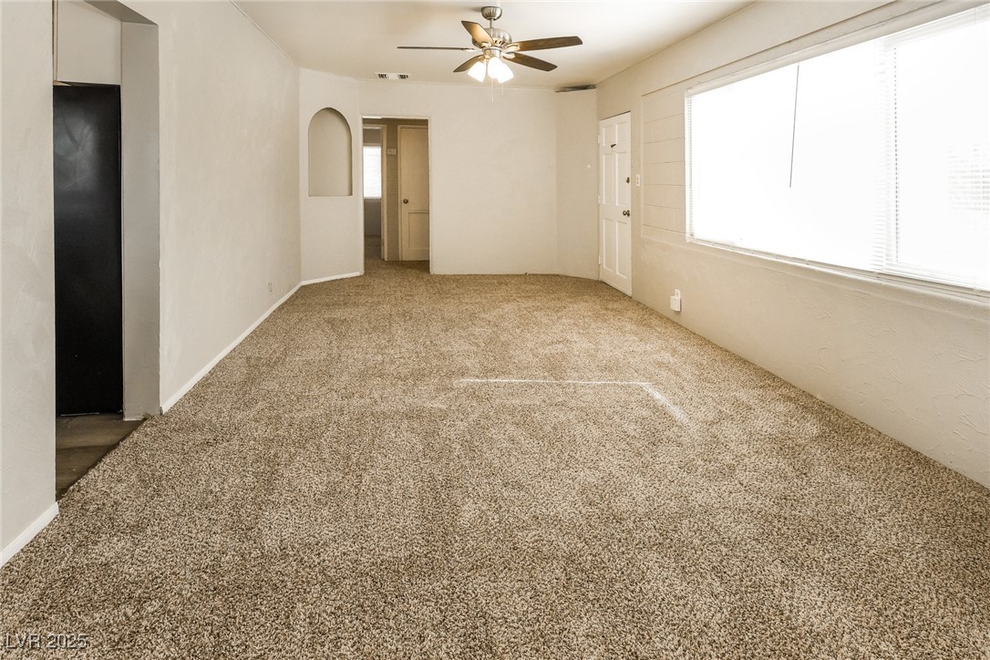 Undisclosed Address Las Vegas, NV 89107 - Photo 3 of 15 Empty room featuring carpet flooring and a ceiling