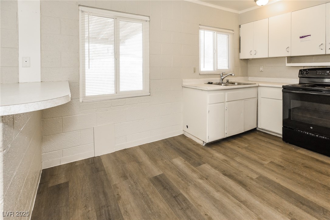 Undisclosed Address Las Vegas, NV 89107 - Photo 5 of 15 Kitchen featuring light countertops, black electri