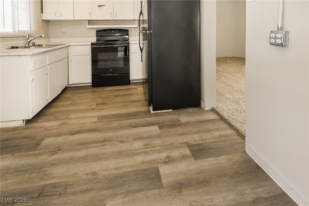 Undisclosed Address Las Vegas, NV 89107 - Photo 6 of 15 Kitchen featuring light countertops, white cabinet