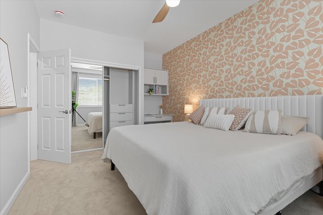 a bedroom with a bed and a cabinets