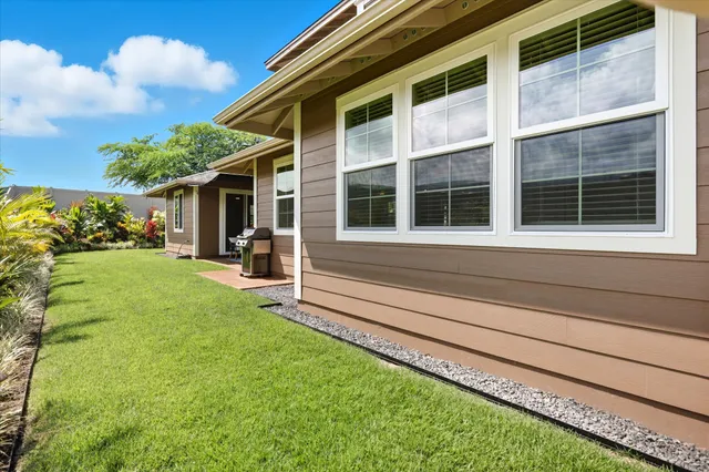 a view of house with yard