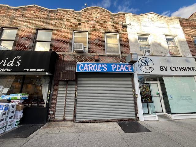 a view of a brick building with many windows