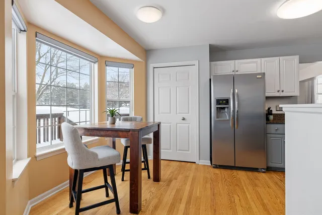 a view of a house with a yard and deck