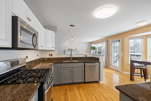 a balcony with wooden floor outdoor seating and stairs