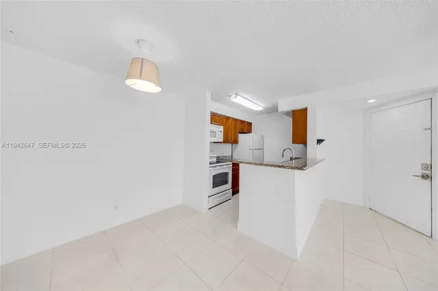 a view of kitchen and wooden floor