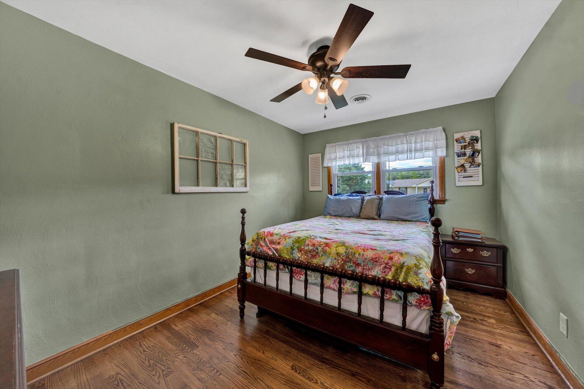 6203 Roberta Road Roanoke, VA 24019 - Photo 11 of 28 a bedroom with a bed and wooden floor