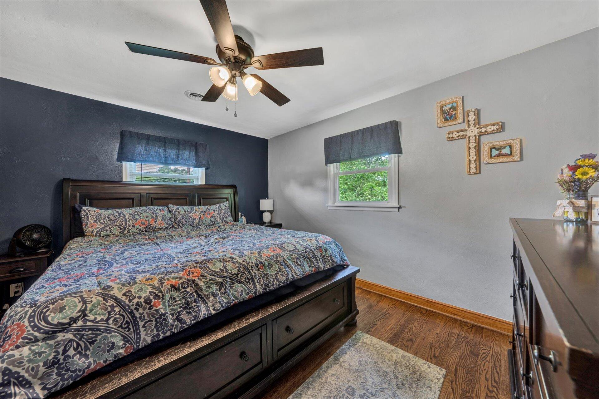 6203 Roberta Road Roanoke, VA 24019 - Photo 14 of 28 a bedroom with a bed and a chandelier