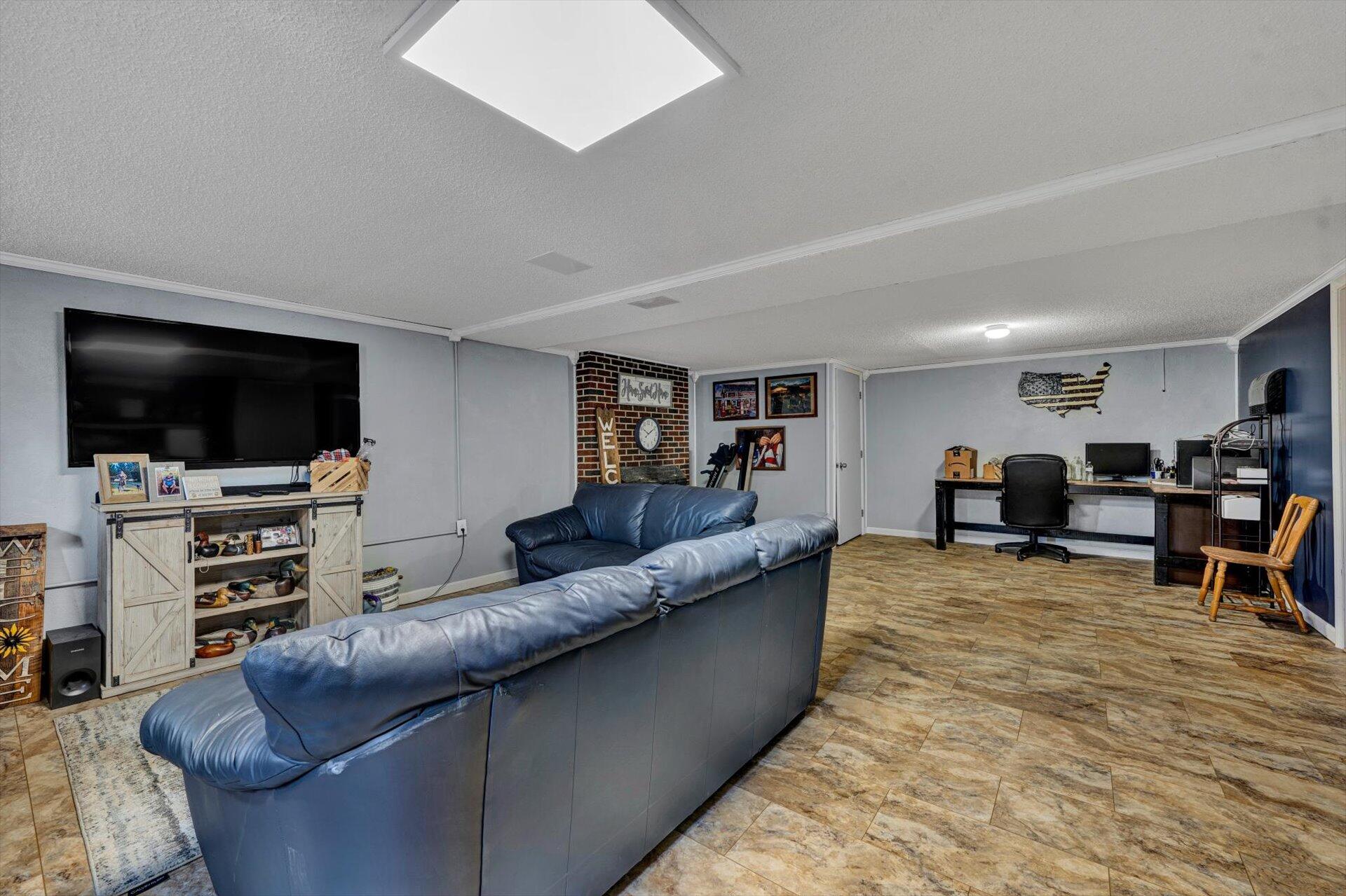 6203 Roberta Road Roanoke, VA 24019 - Photo 15 of 28 a living room with furniture and a flat screen tv