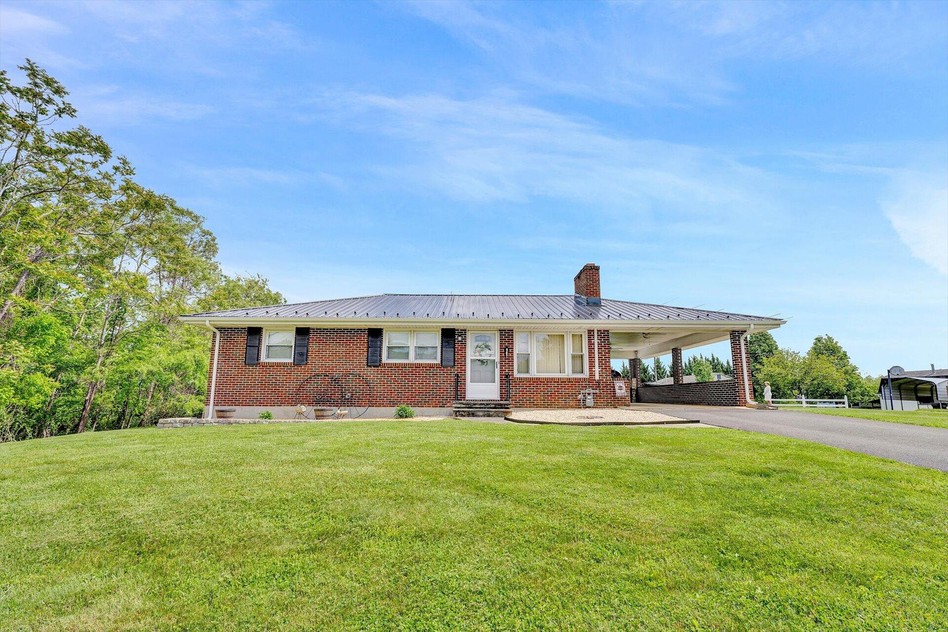 6203 Roberta Road Roanoke, VA 24019 - Photo 2 of 28 a view of a house with a yard and sitting area