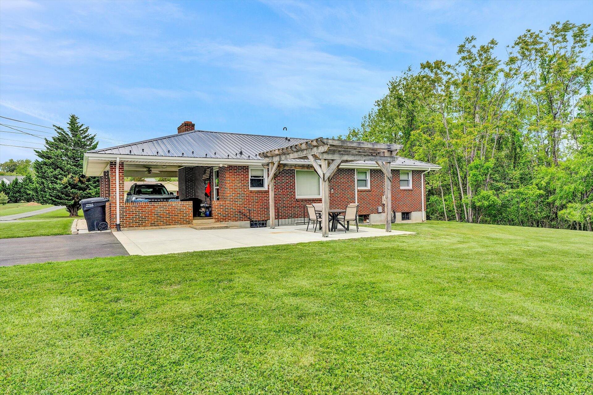 6203 Roberta Road Roanoke, VA 24019 - Photo 23 of 28 a view of a house with a backyard patio and swimming pool