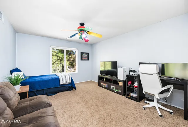 a bedroom with a bed and furniture