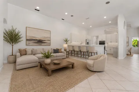 a living room with furniture and a table