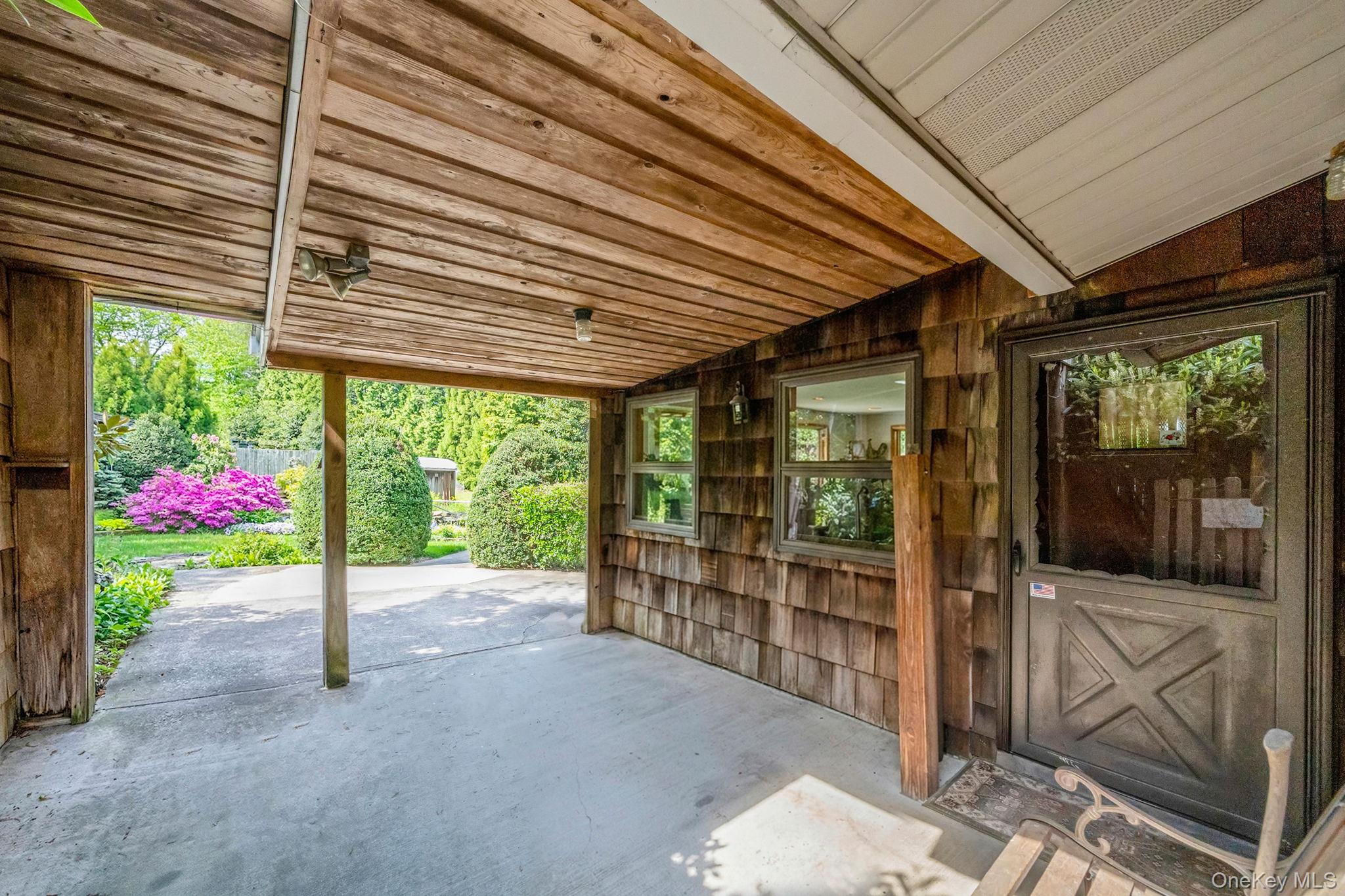 280 Deforest Road North Dix Hills, NY 11746 - Photo 4 of 37 a view of a porch with wooden floor and garden