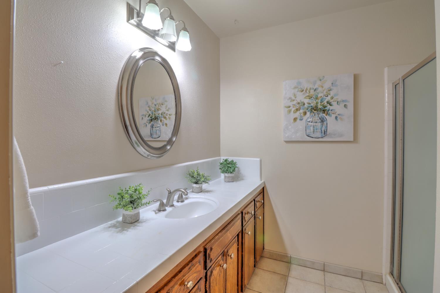 6265 North Colonial Avenue Fresno, CA 93704 - Photo 18 of 22 a view of bathroom with fan and wooden floor
