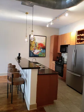 a view of a livingroom with furniture and windows