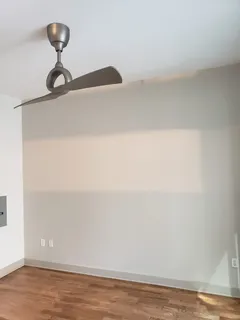 a view of a livingroom with furniture and windows