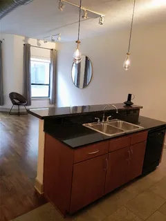a stove top oven sitting inside of a kitchen