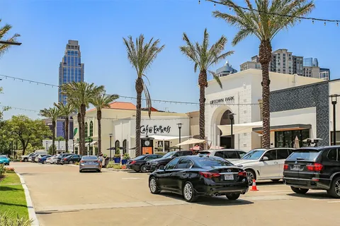 a view of building with retail shops