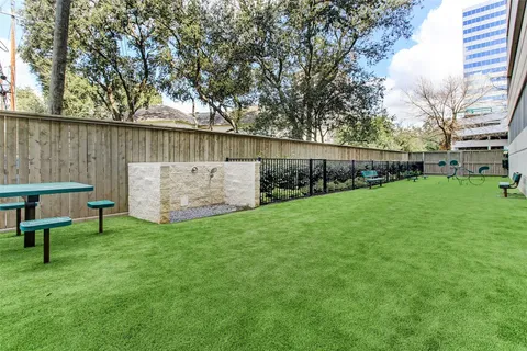 a view of a backyard with potted plants