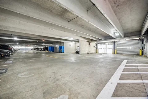 a large room with lots of counter space and windows