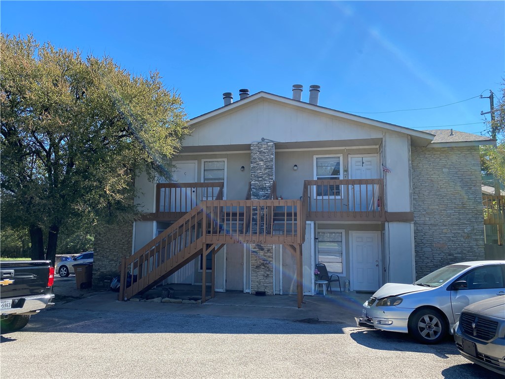 11906 Alpheus Avenue, Unit D Austin, TX 78759 - Photo 1 of 10 a car parked in front of house with wooden fence
