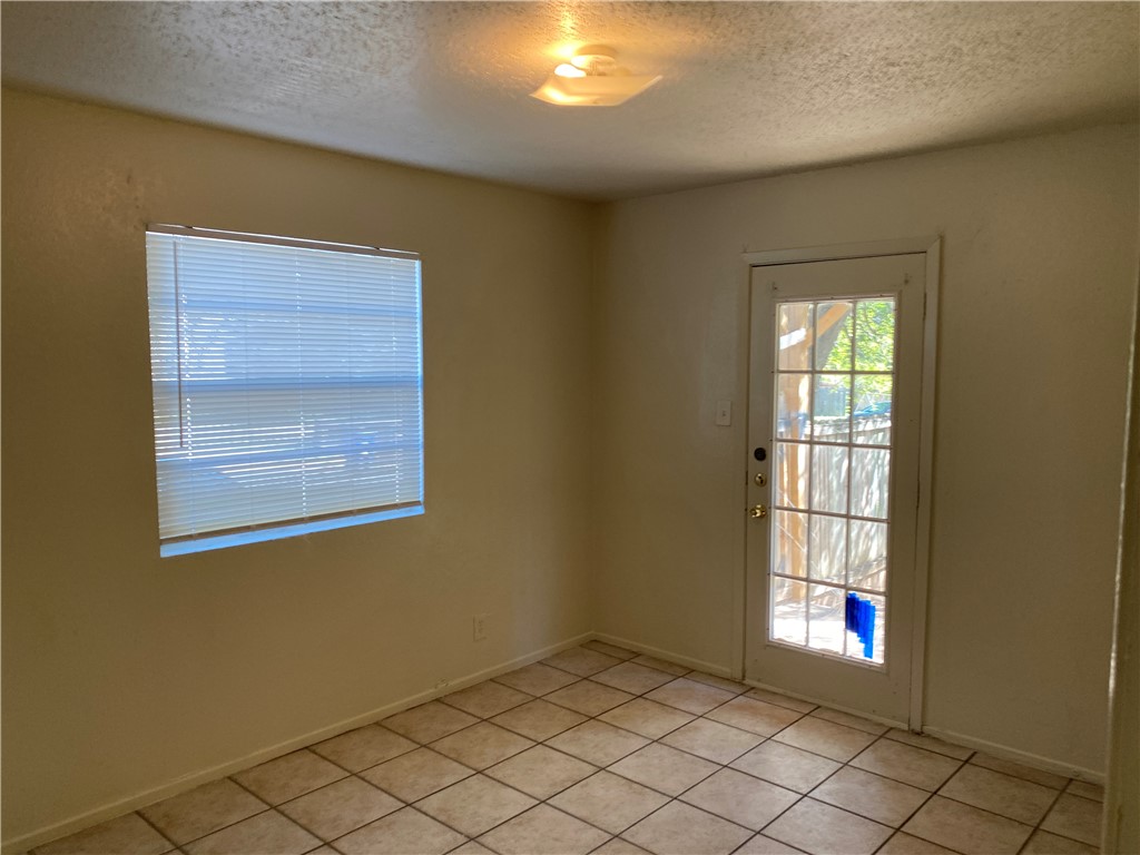 11906 Alpheus Avenue, Unit D Austin, TX 78759 - Photo 6 of 10 an empty room with windows