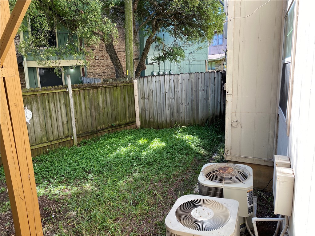 11906 Alpheus Avenue, Unit D Austin, TX 78759 - Photo 10 of 10 a view of backyard of house and outdoor seating