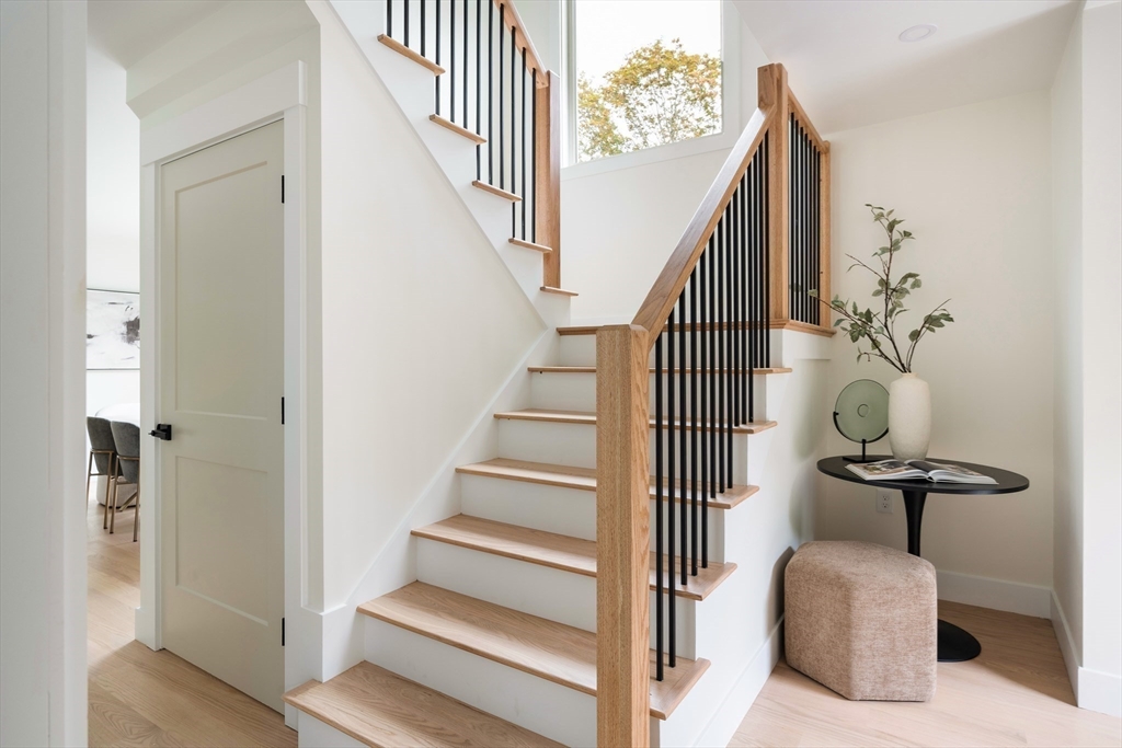 76 Harding Street Newton, MA 02465 - Photo 12 of 27 a view of entryway and hall with wooden floor