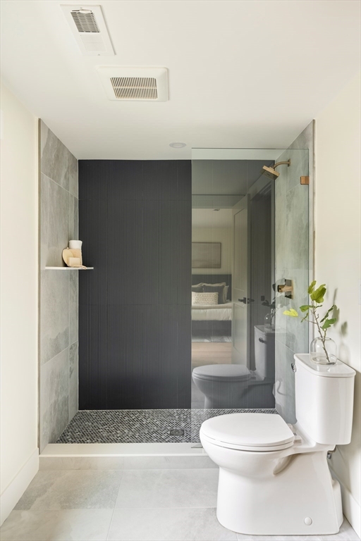 76 Harding Street Newton, MA 02465 - Photo 19 of 27 a bathroom with a sink a toilet and shower