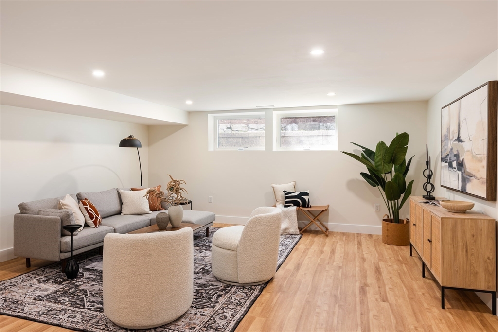 76 Harding Street Newton, MA 02465 - Photo 23 of 27 a living room with furniture and a potted plant