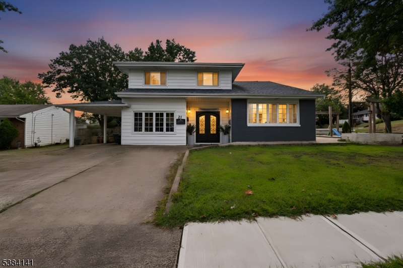 231 Starmond Avenue Clifton, NJ 07013 - Photo 1 of 32 a front view of a house with a yard and trees