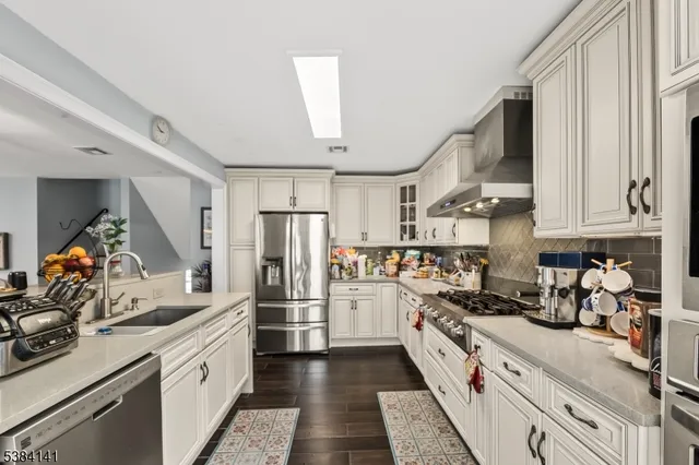a bedroom with a bed window and wall painting